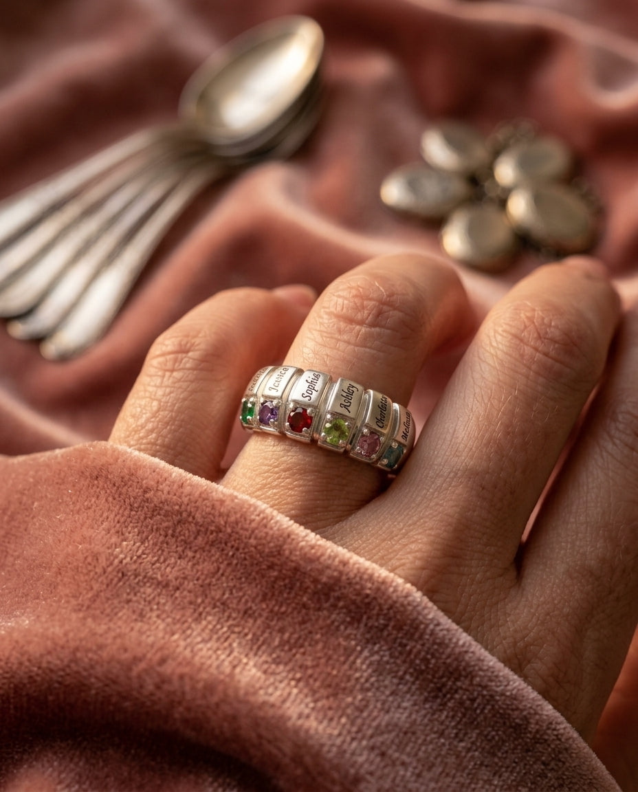 Six-stone family ring at wearable scale