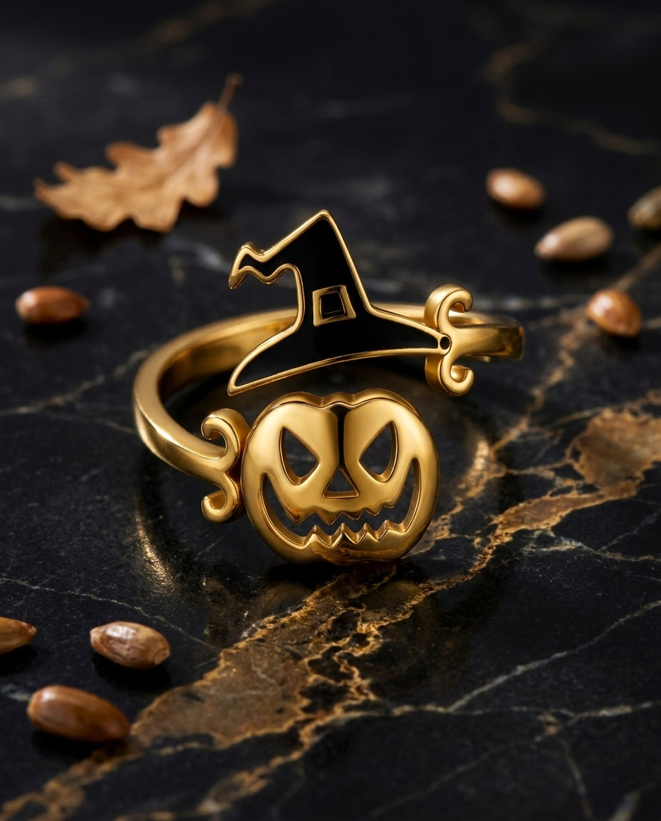 Pumpkin and witch-hat ring motif detail