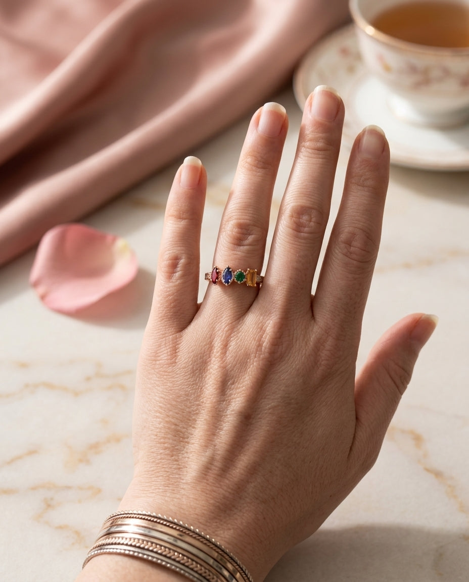 Four-stone blended family ring worn