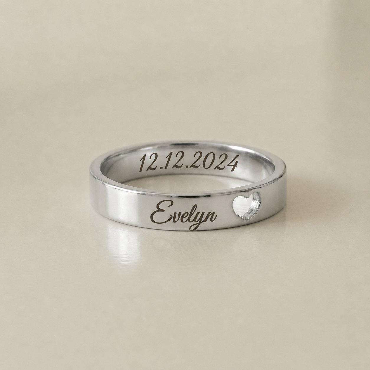 Personalized name and date ring with engraved heart detail